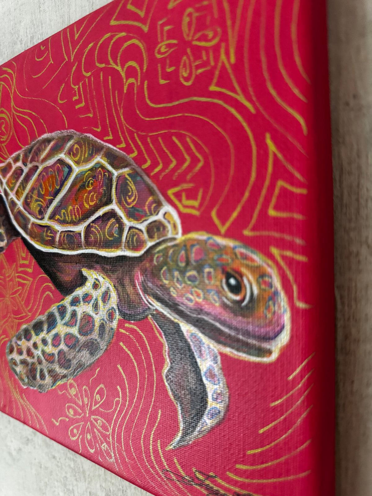 A-close-up-of-a-canvas-wall-art-print-featuring-a-painted-sea-turtle-on-a-bright-red-background-with-gold-abstract-wave-and-floral-patterns-psychedelic-art-artwork-collector-art