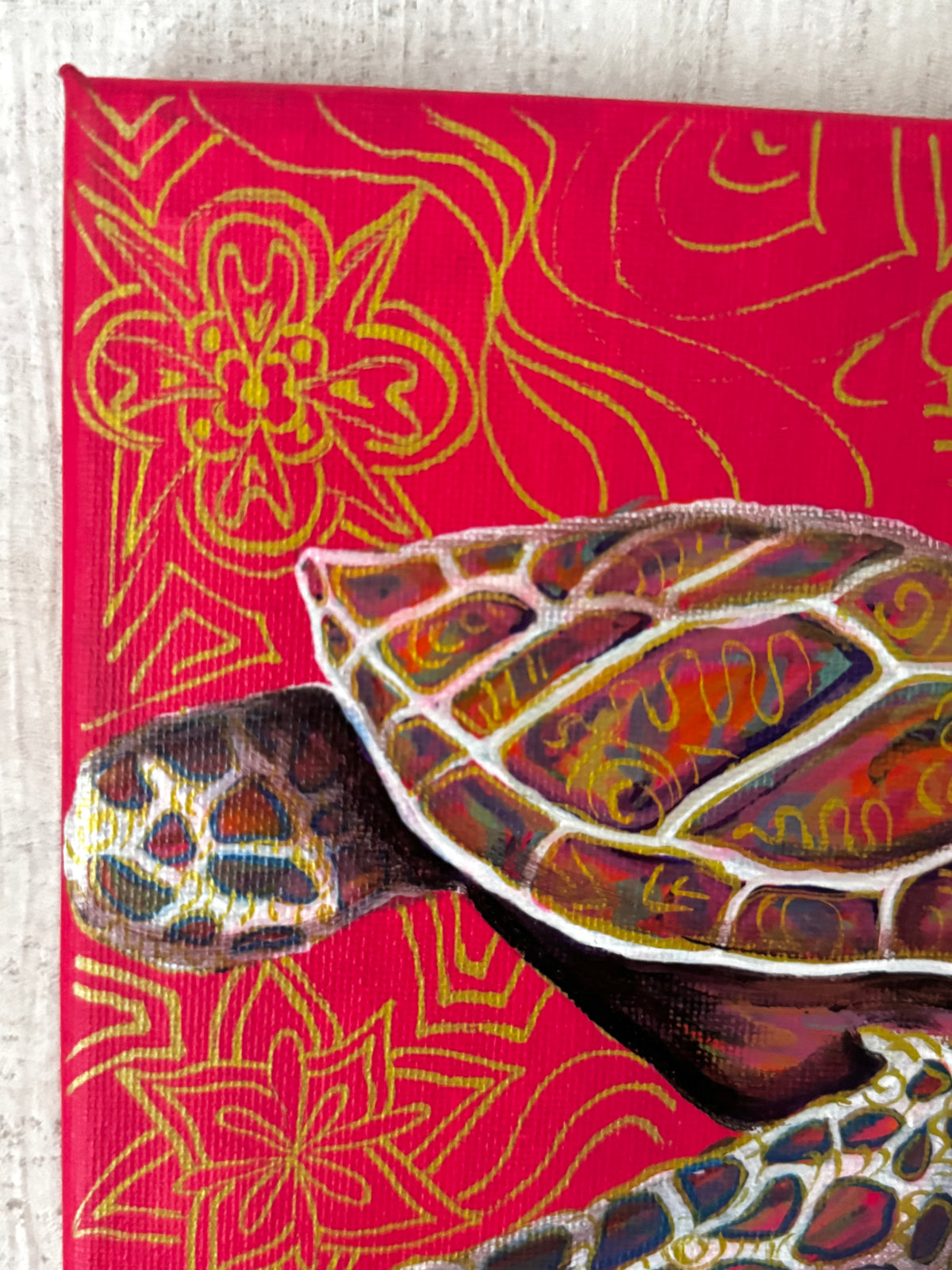 Close-up-of-a-colorful-painted-sea-turtle-on-a-bright-red-background-with-gold-floral-line-patterns-ingriodaart-ingrida-tautkute-original-acrylic-painting